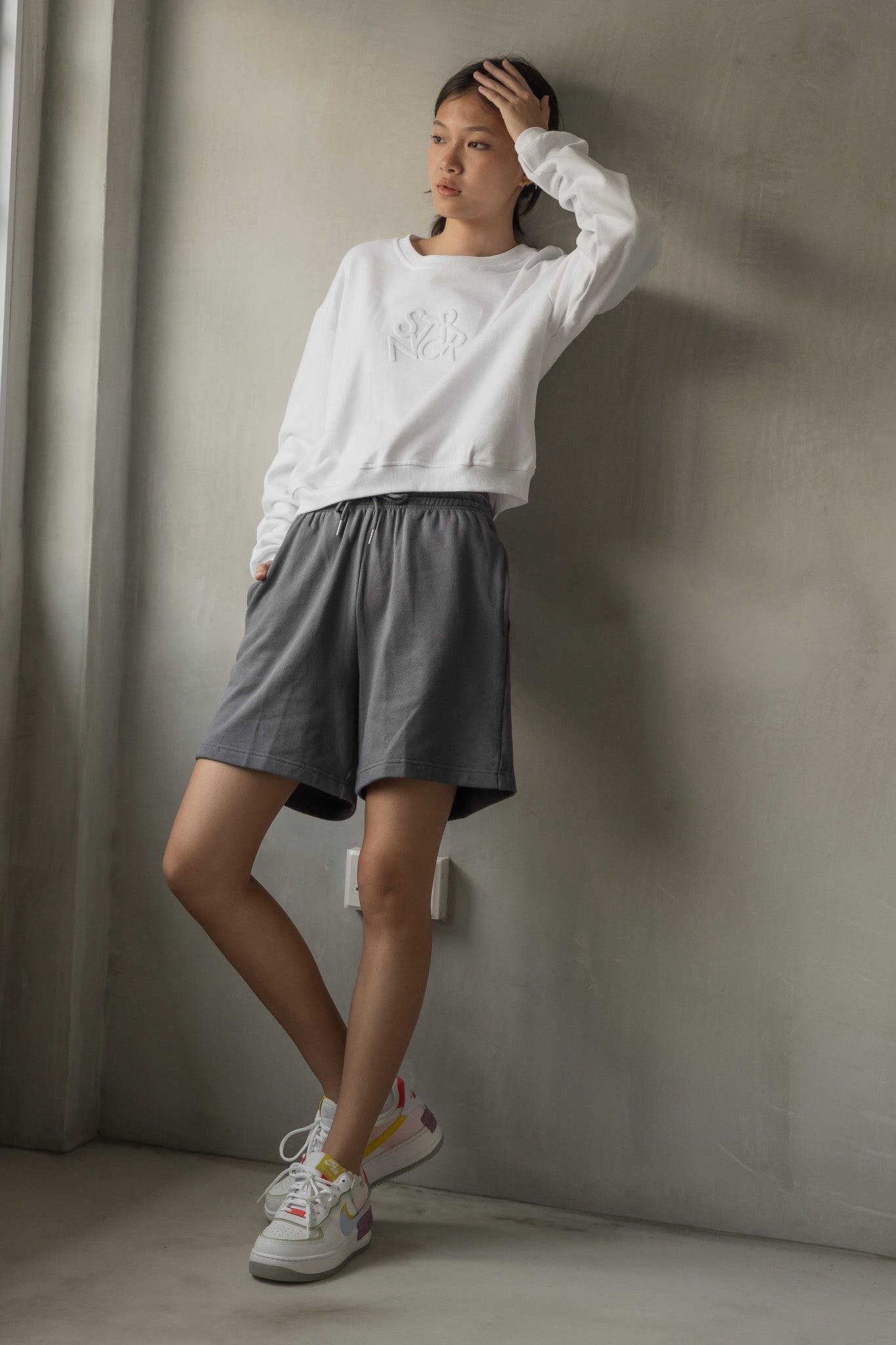 STRANGER Embossed Logo Cropped Sweatshirt in White